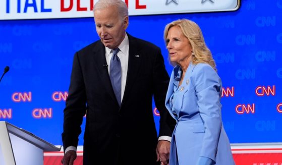 President Joe Biden holds first lady Jill Biden's hand as they prepare to leave the stage after Thursday's presidential debate in Atlanta.