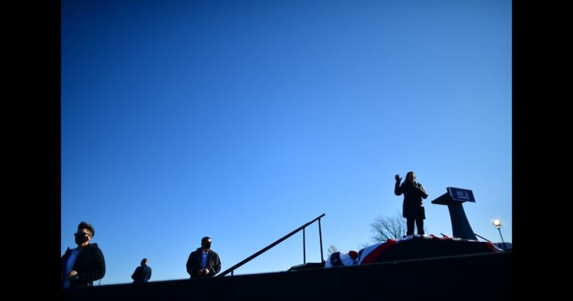 A trio of Secret Service agents monitor activity as Sen. Kamala Harris (D-CA) speaks at a drive-in rally on the eve of the general election on November 2, 2020 in Bethlehem, Pennsylvania.