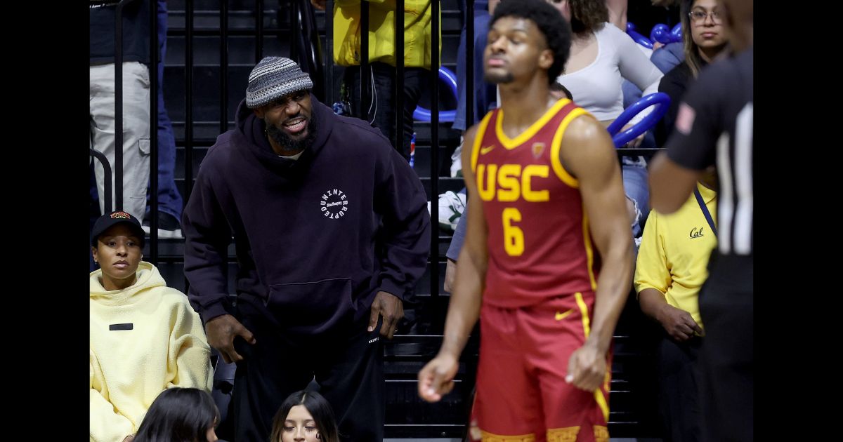 LeBron James #23 of the Los Angeles Lakers shouts to his son, Bronny James #6 of the USC Trojans, during Bronny's game against the California Golden Bears at Haas Pavilion on February 7, 2024 in Berkeley, California.