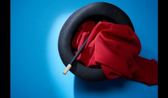 This Getty stock image shows a magician's wand and scarf in a hat.