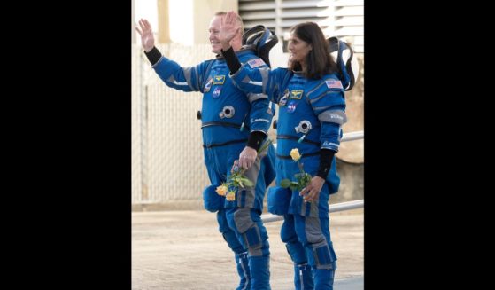 NASA astronauts Butch Wilmore, left, and Suni Williams, wearing Boeing spacesuits, are seen as they prepare to depart the Neil A. Armstrong Operations and Checkout Building for Launch Complex 41 on Cape Canaveral Space Force Station to board the Boeing CST-100 Starliner spacecraft for the Crew Flight Test launch, at NASA's Kennedy Space Center on June 5, 2024 in Cape Canaveral, Florida.