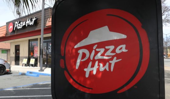 A sign is posted on the exterior of a Pizza Hut restaurant on March 25, 2024 in San Pablo, California.