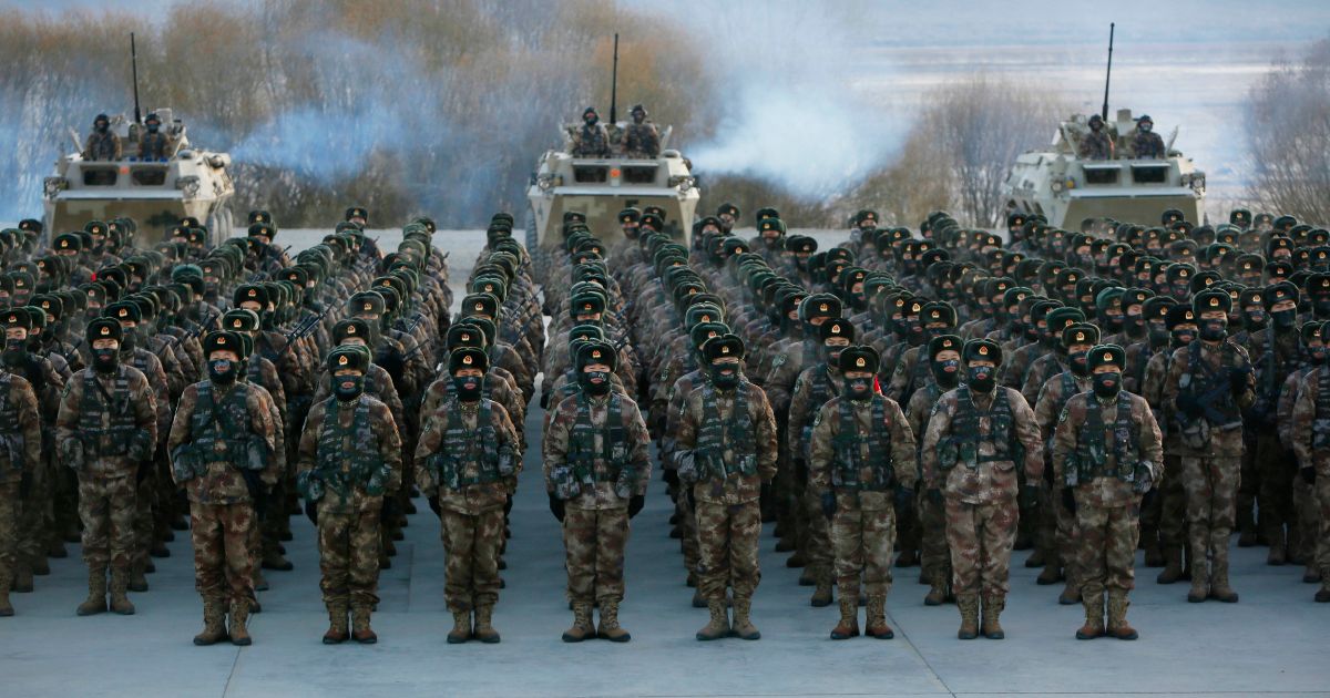 This photo taken on January 4, 2021 shows Chinese People's Liberation Army (PLA) soldiers assembling during military training at Pamir Mountains in Kashgar, northwestern China's Xinjiang region.