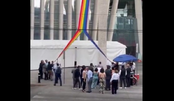 A "pride" flag is ripped from a Mexican government building last week.