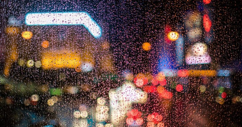 With a focus on the foreground, this Getty stock image shows the Las Vegas strip from behind a window, on a rainy night.