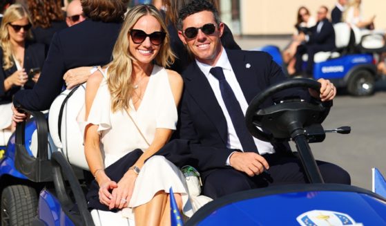 Golf star Rory McIlroy and his wife, Erica, are smiling in a 2023 file photo in Rome at the opening ceremony of the Ryder Cup competition.