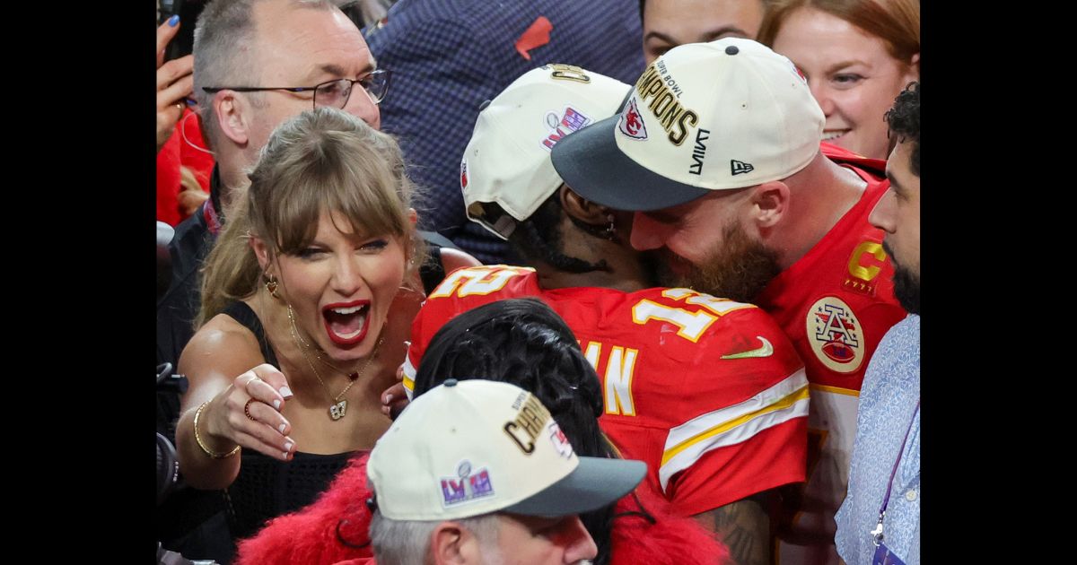 (L-R) Taylor Swift, wide receiver Mecole Hardman Jr. #12 and tight end Travis Kelce #87 of the Kansas City Chiefs celebrate after the Chiefs' 25-22 overtime victory over the San Francisco 49ers in Super Bowl LVIII at Allegiant Stadium on February 11, 2024 in Las Vegas, Nevada.