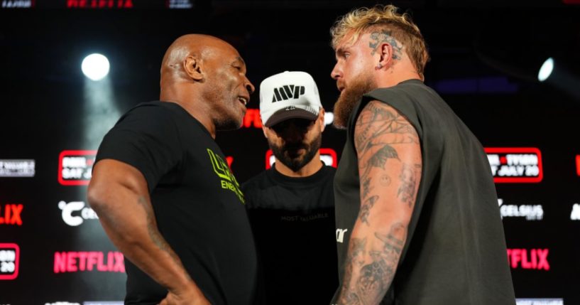 (L-R) Mike Tyson, Nakisa Bidarian and Jake Paul pose onstage during the Jake Paul vs. Mike Tyson Boxing match Arlington press conference at Texas Live! on May 16, 2024 in Arlington, Texas.