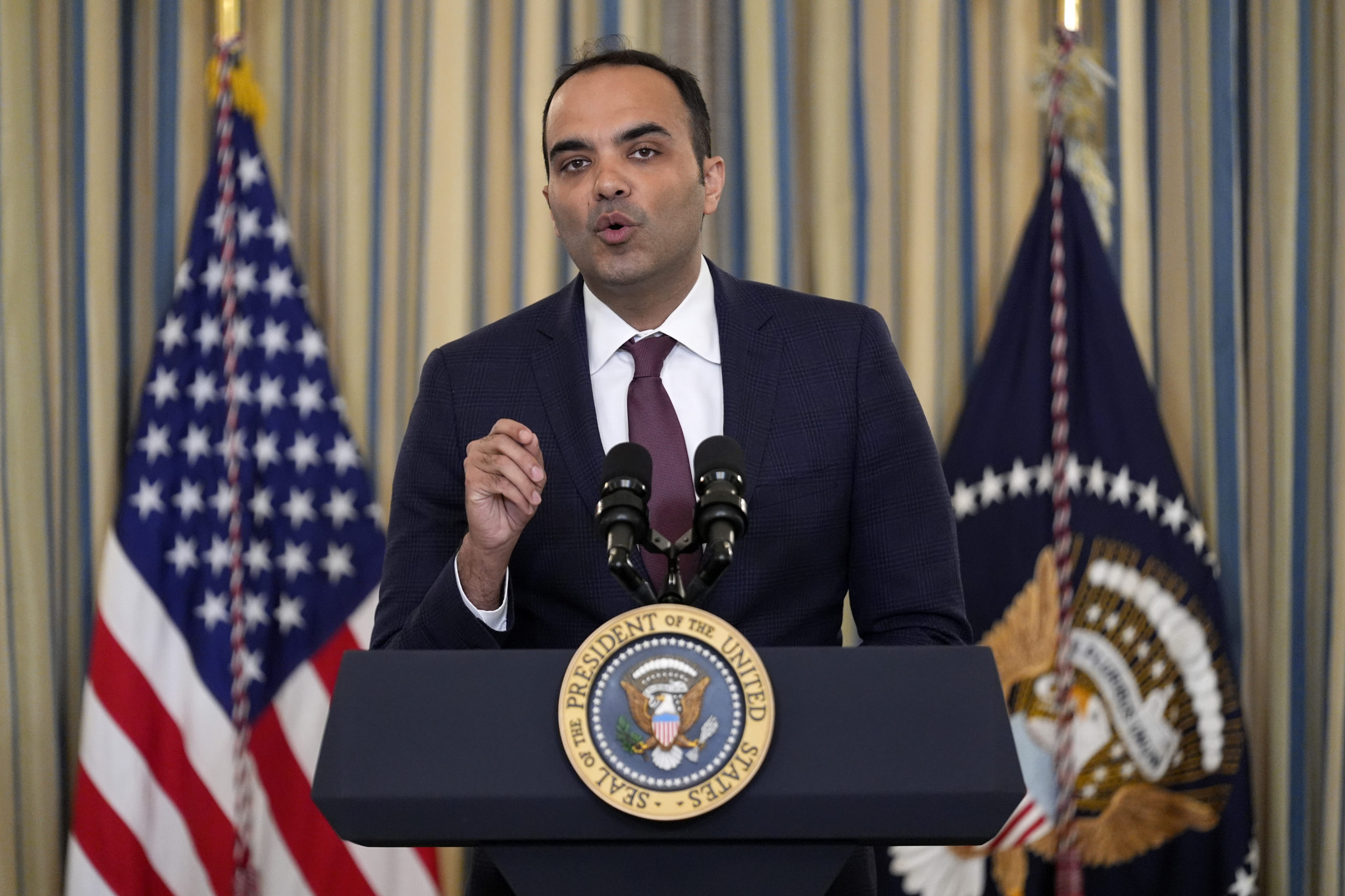 Rohit Chopra, director of the Consumer Financial Protection Bureau, speaks as President Joe Biden meets with his Competition Council to announce new actions to lower costs for families in the State Dining Room of the White House in Washington, D.C., on March 5.