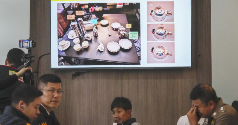 Thai police display photos of evidence during a news conference at the Lumpini police station in Bangkok on Wednesday.