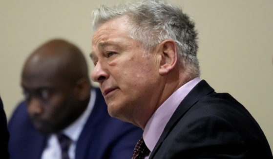 Actor Alec Baldwin listens during his hearing in Santa Fe County District Court in Santa Fe, New Mexico, on Wednesday.