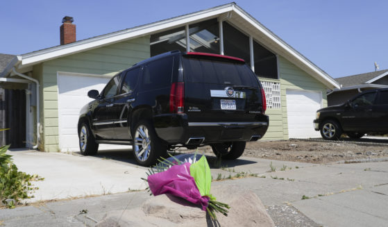 Flowers are seen Thursday in front of a home on Kitty Hawk Road in the City of Alameda, California. A California man is in custody after fatally shooting his wife, their 6-year-old son and his wife's parents, a San Francisco Bay Area police department said.