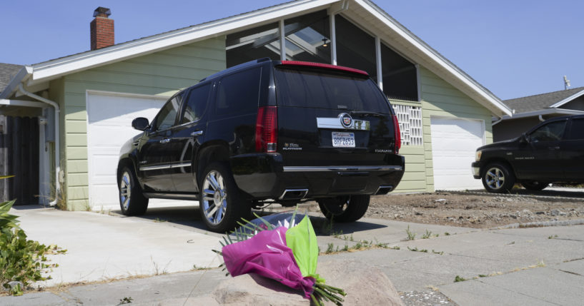 Flowers are seen Thursday in front of a home on Kitty Hawk Road in the City of Alameda, California. A California man is in custody after fatally shooting his wife, their 6-year-old son and his wife's parents, a San Francisco Bay Area police department said.