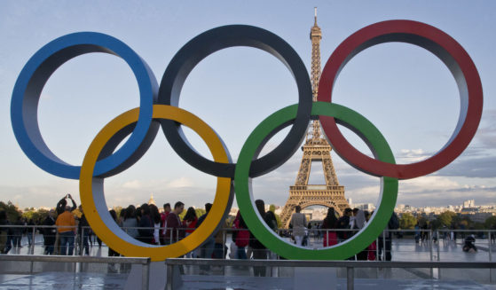 The Olympic rings are set up at Trocadero plaza that overlooks the Eiffel Tower in Paris, on Sept. 14, 2017.