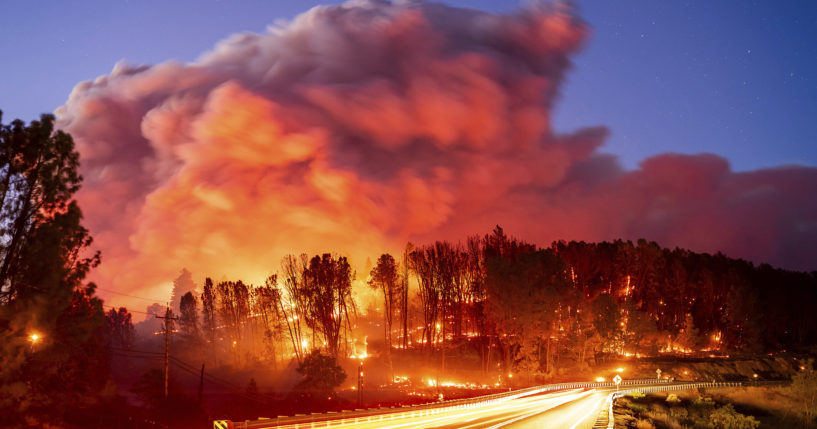 The Park Fire burns along Highway 32 in the Forest Ranch community of Butte County, California, on Thursday.