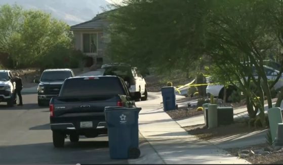 Police tape is pictured at the scene where a 2-year-old girl died after being left in a car for 30 minutes to an hour in Marana, Arizona, on Tuesday.