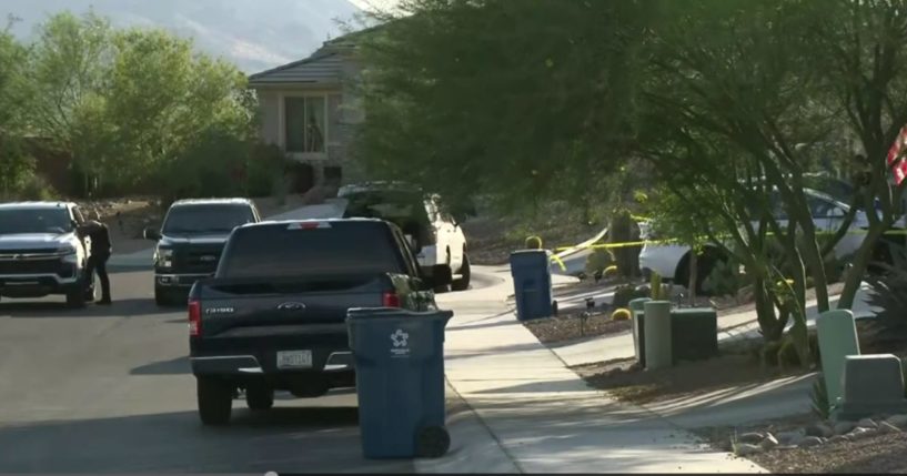 Police tape is pictured at the scene where a 2-year-old girl died after being left in a car for 30 minutes to an hour in Marana, Arizona, on Tuesday.