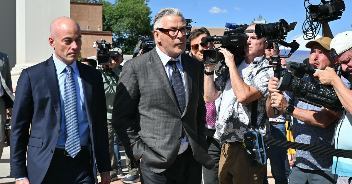 Actor Alec Baldwin leaves the courthouse with one of his lawyers after the first day in his involuntary manslaughter trial in Santa Fe, New Mexico, on Tuesday.