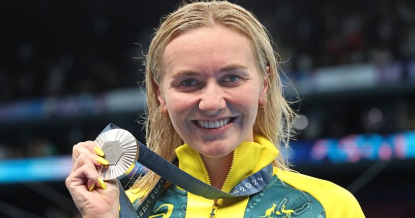 Olympic swimmer Ariarne Titmus of Australia poses with her silver medal following the swimming medal ceremony after the Women’s 200m Freestyle Final in Nanterre, France, on July 29.