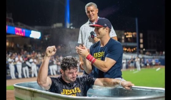 Brewer Hicklen, an outfielder with the Nashville Sounds, baptizes his teammate, Wes Clarke, after a game on Saturday. (Wes Clarke / Instagram)