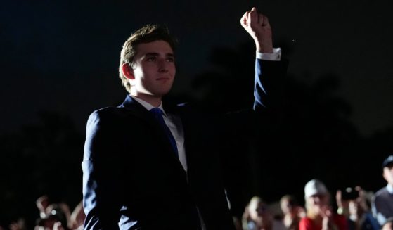 Barron Trump gestures as his father, Republican presidential candidate and former President Donald Trump, speaks at a campaign rally at Trump National Doral Miami in Doral, Florida, on Tuesday.