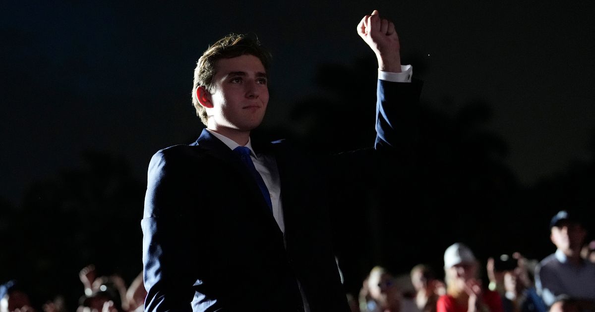 Barron Trump gestures as his father, Republican presidential candidate and former President Donald Trump, speaks at a campaign rally at Trump National Doral Miami in Doral, Florida, on Tuesday.