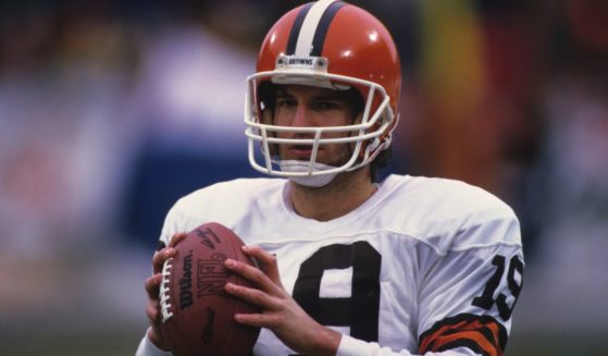 Then-quarterback Bernie Kosar of the Cleveland Browns looks on from the field before a game in Cleveland, Ohio, in 1985.