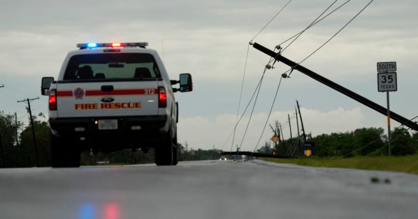 Power lines downed by the effects of Hurricane Beryl block a highway near Palacios, Texas, on Monday.