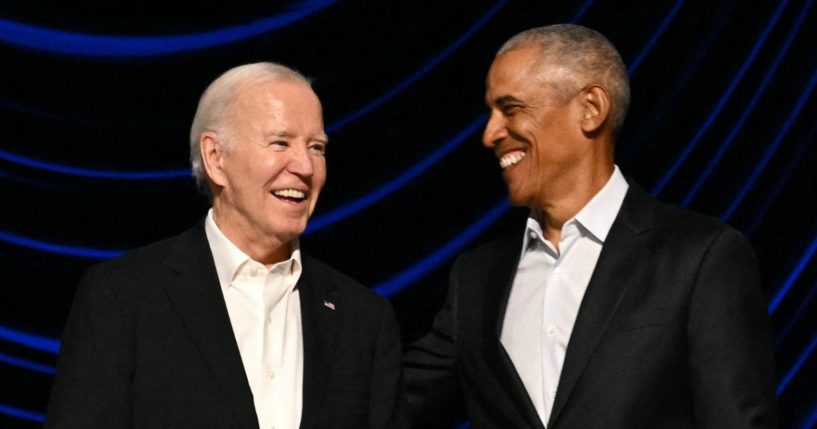 President Joe Biden stands on stage with former President Barack Obama during a campaign fundraiser at the Peacock Theater in Los Angeles on June 15.