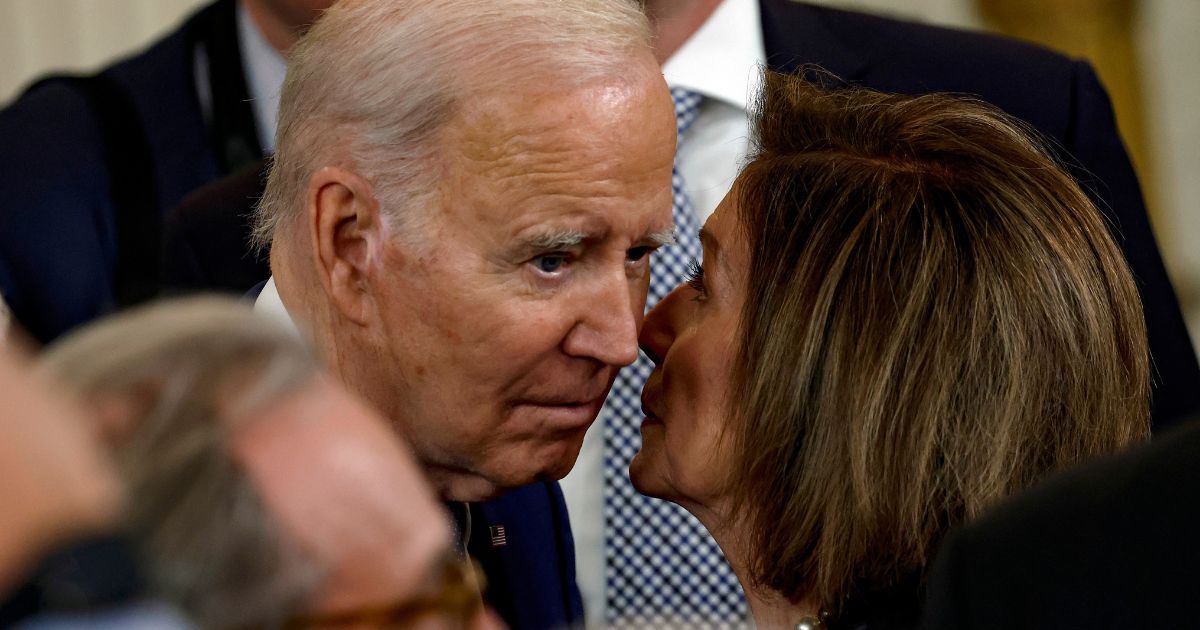 President Joe Biden speaks to Democratic Rep. Nancy Pelosi of California after an event in the East Room of the White House in Washington on March 23, 2023.