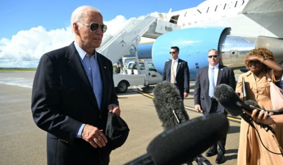 President Joe Biden speaks to reporters before boarding Air Force One in Madison, Wisconsin, on Friday.