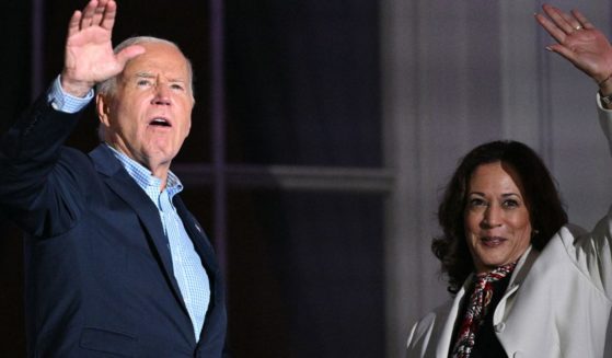 President Joe Biden, left, and Vice President Kamala Harris, right, wave after watching the Independence Day fireworks display from the Truman Balcony of the White House in Washington, D.C., on Thursday.