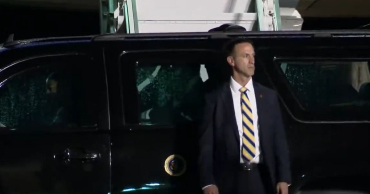 President Joe Biden appears to struggle to get into a vehicle.