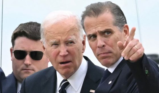 President Joe Biden talks with his son Hunter Biden upon arrival at Delaware Air National Guard Base in New Castle, Delaware, on June 11.