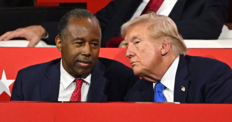 Former Housing and Urban Development Secretary Dr. Ben Carson speaks with Republican presidential candidate and former President Donald Trump on the second day of the Republican National Convention at the Fiserv Forum in Milwaukee on Tuesday.