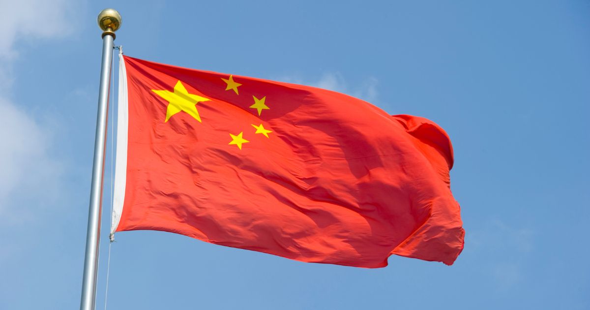 The Chinese flag flaps in the wind in Shanghai on Aug. 5, 2010.