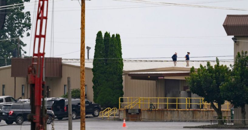 On July 14, two FBI investigators scan the roof of AGR International Inc, the building adjacent to the Butler Fairgrounds, from which shooter Matthew Thomas Crooks fired at former President Donald J. Trump.