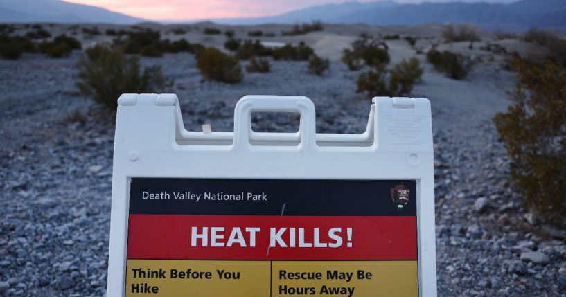 A sign reading "Heat Kills!" is seen Monday during a long-duration heat wave at Death Valley National Park, California.