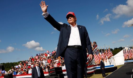 Republican presidential candidate and former President Donald Trump walks offstage after giving remarks at a rally at Greenbrier Farms in Chesapeake, Virginia, on Friday.