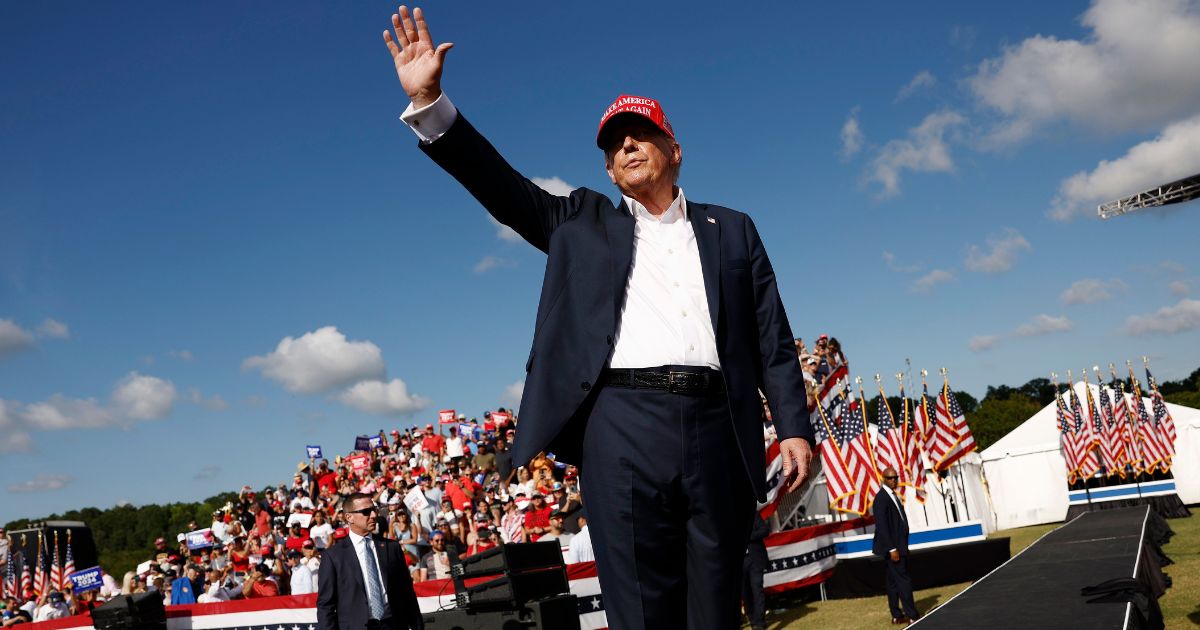 Republican presidential candidate and former President Donald Trump walks offstage after giving remarks at a rally at Greenbrier Farms in Chesapeake, Virginia, on Friday.