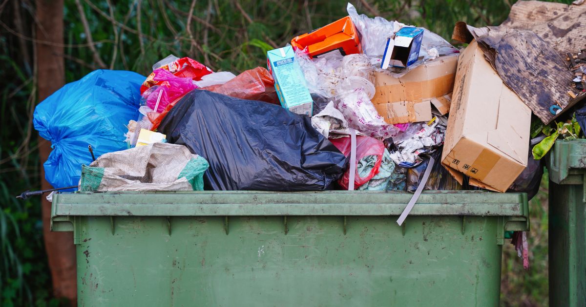 This stock image shows a full dumpster.