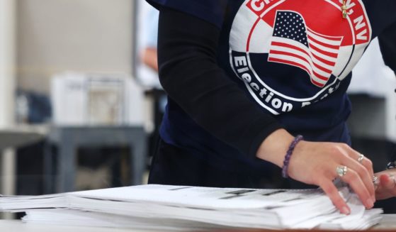 A Clark County Election Department worker sorts ballots in the tabulation area at the Clark County Election Department during the 2022 midterm election in Las Vegas, Nevada, on Nov. 9, 2022.