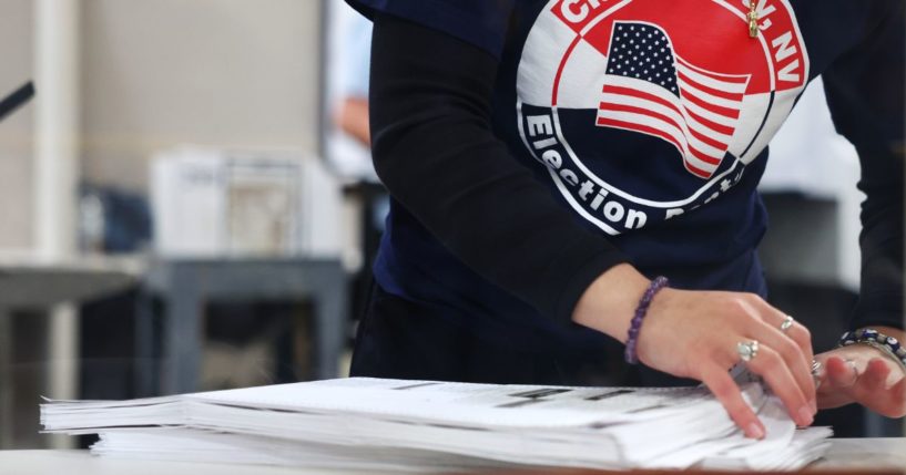 A Clark County Election Department worker sorts ballots in the tabulation area at the Clark County Election Department during the 2022 midterm election in Las Vegas, Nevada, on Nov. 9, 2022.