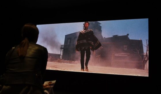 Visitors watch a clip of the film "A Fistful of Dollars" at the Cinémathèque Française in Paris on Oct. 8, 2018.