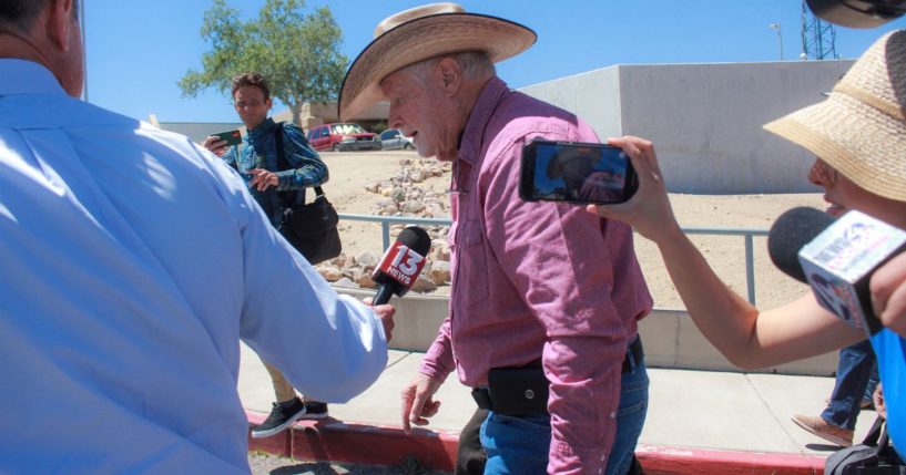 George Alan Kelly, center, is followed by reporters as he exits the Santa Cruz County Courthouse in Nogales, Arizona, on April 29.