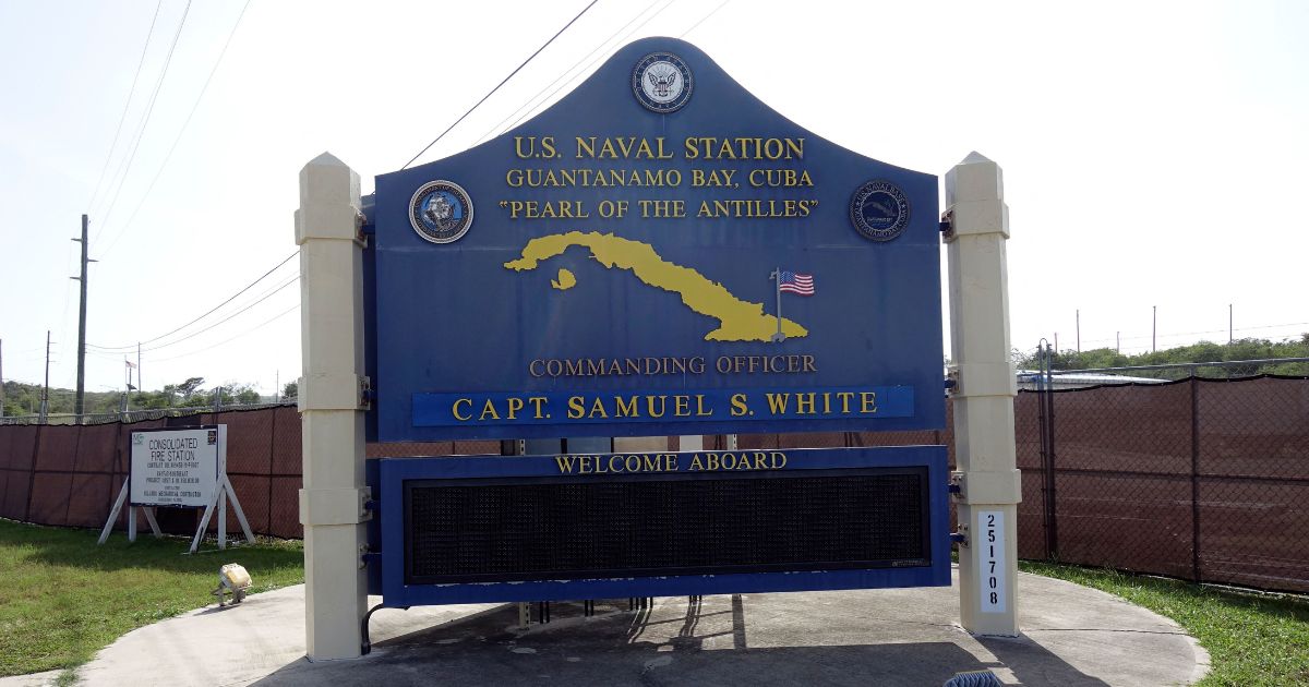 A photo screened by U.S. military officials on Sept. 7, 2021, shows a sign for the U.S. Naval Station in Guantanamo Bay, Cuba.