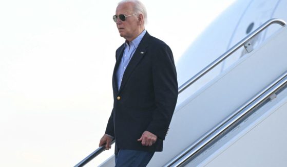 President Joe Biden disembarks from Air Force One upon arrival at Delaware Air National Guard Base in New Castle, Delaware, on Friday.