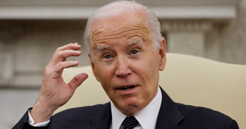 President Joe Biden speaks to reporters in the Oval Office of the White House in Washington on May 7.