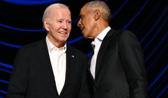 President Joe Biden, left, stands with former President Barack Obama, right, onstage during a campaign fundraiser in Los Angeles, California, on June 15.