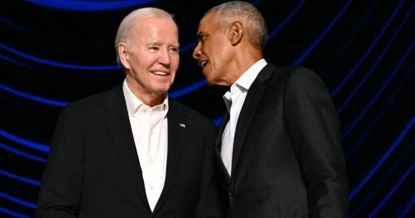 President Joe Biden, left, stands with former President Barack Obama, right, onstage during a campaign fundraiser in Los Angeles, California, on June 15.